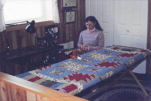 Johanna spinning yarn in her shop
